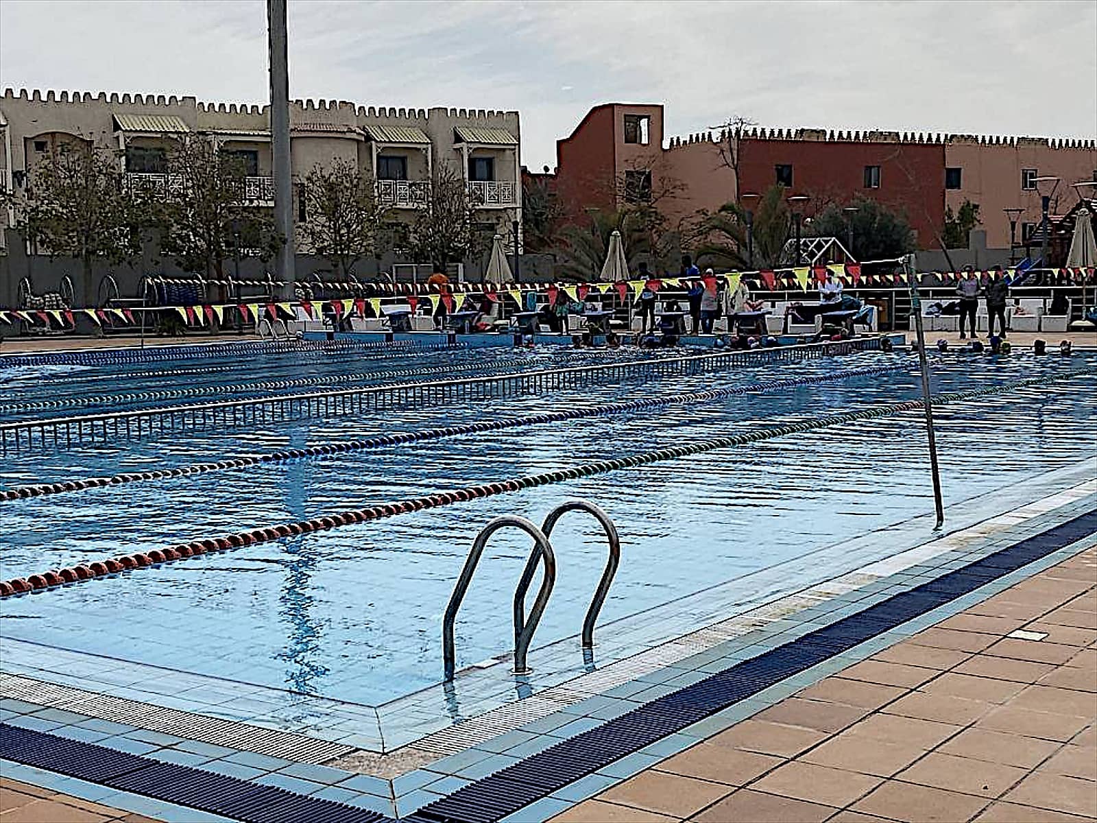 Swimming pool at Senzo Club with lane ropes.