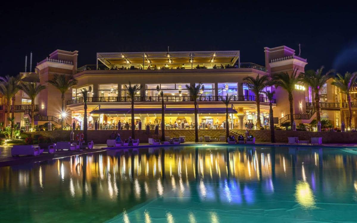 Albatros Palace Resort restaurant terrace and pool at night.